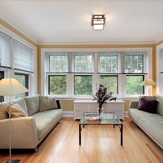 sitting area in a home surrounded by windows