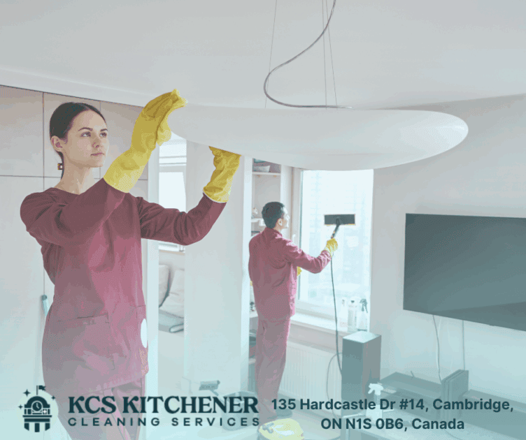 KCS Kitchener Cleaning Services team deep cleaning a residential home—dusting light fixtures and steam-cleaning windows in Cambridge, Ontario.